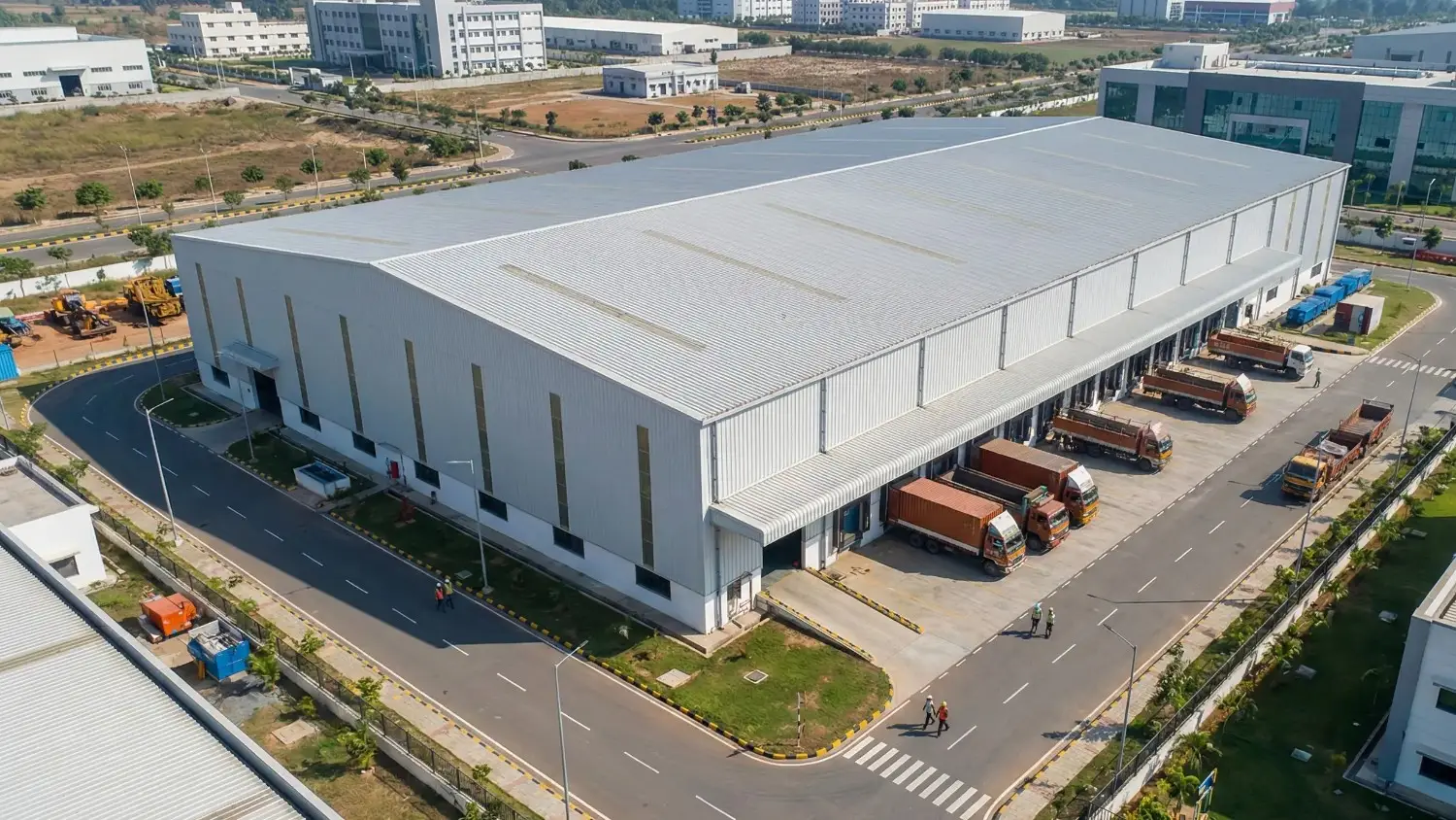 Completed industrial PEB facility showing structural steel construction and engineering quality