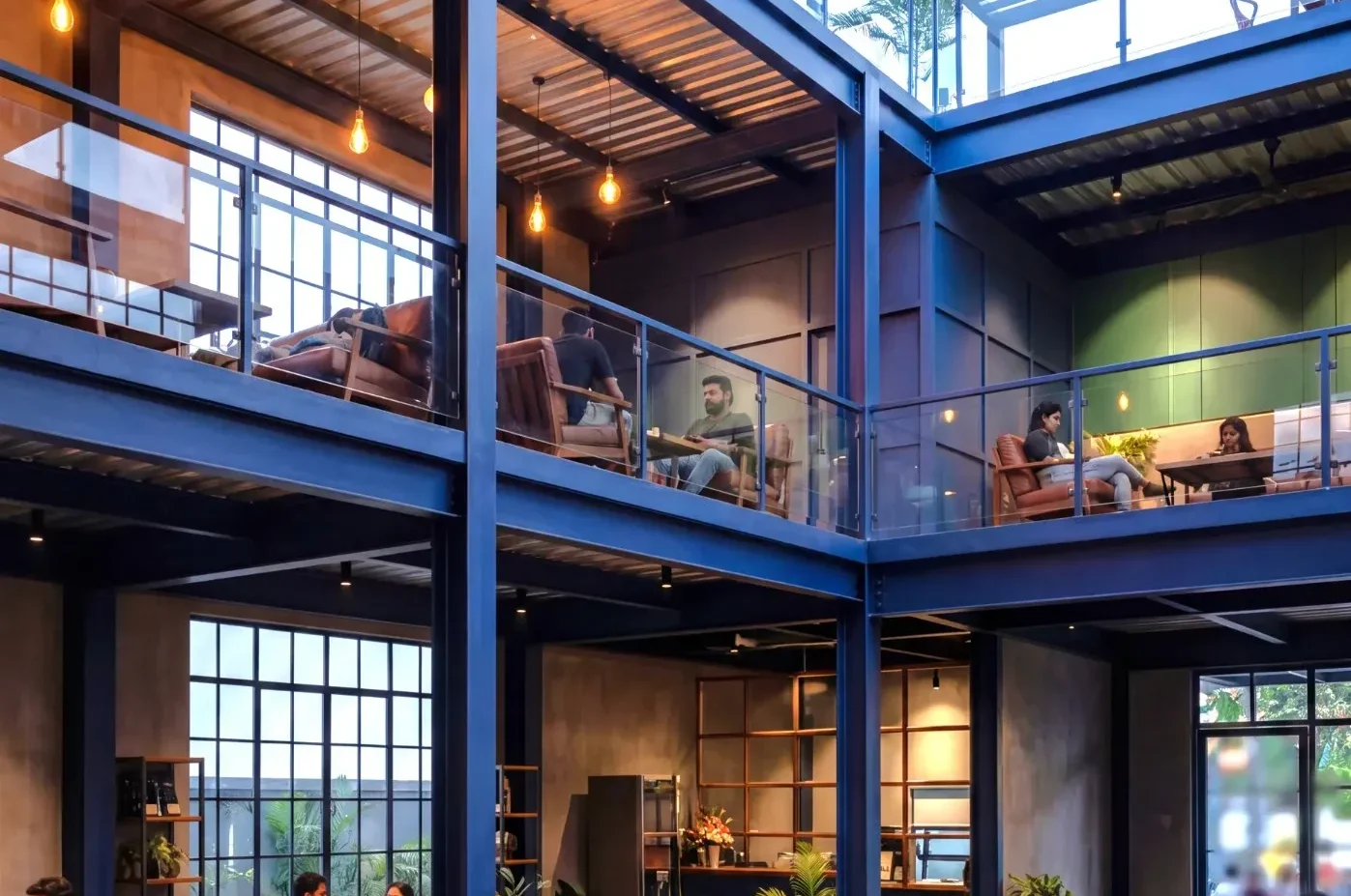 Mezzanine floor manufacturer in Tamil Nadu showing multi level steel structure installation by Pentaumec Space Structures Coimbatore